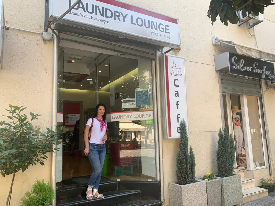 The owner at the entrance of LG Laundry Lounge in Podgorica